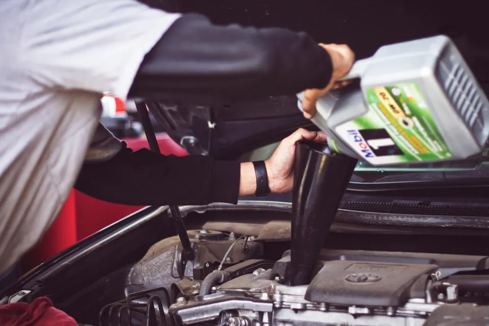 Vehicle maintenance being performed in an automotive shop